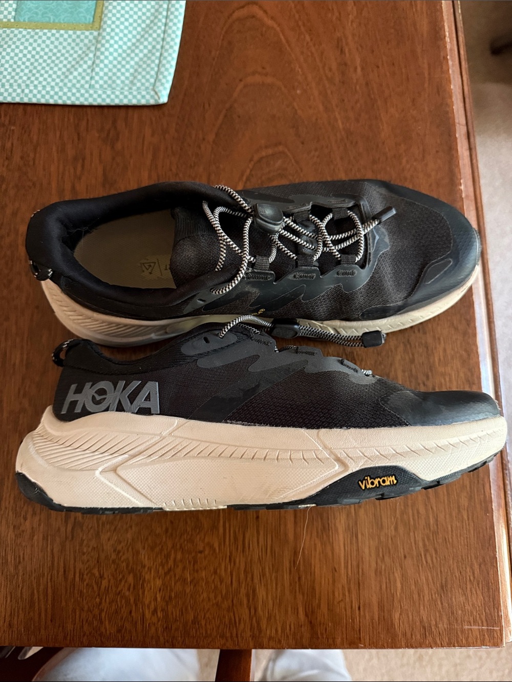 Hoka Black and Cream Athletic Trail Shoes